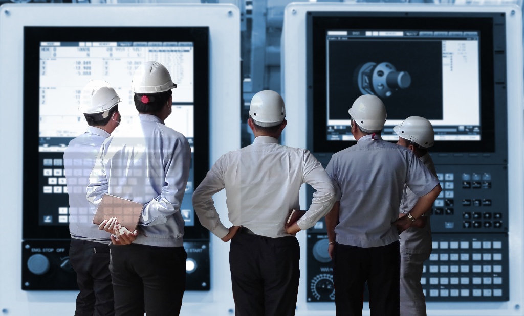 shutterstock_5 hardhat factory men looking at large displays shutterstock_5 hardhat factory men looking at large displays